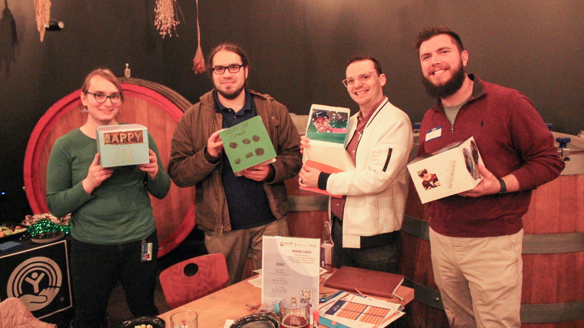 Group of 4 People holding time capsules 